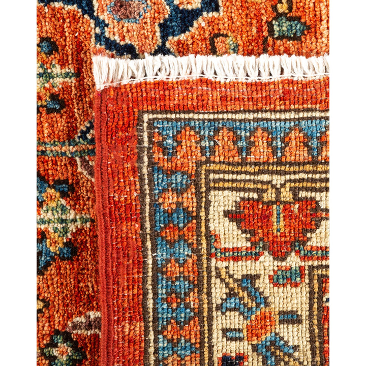 Close-up of an intricately designed and colorful handmade carpet.