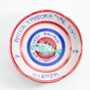 Hand-painted ceramic plate depicts a vibrant fish motif with inscriptions.