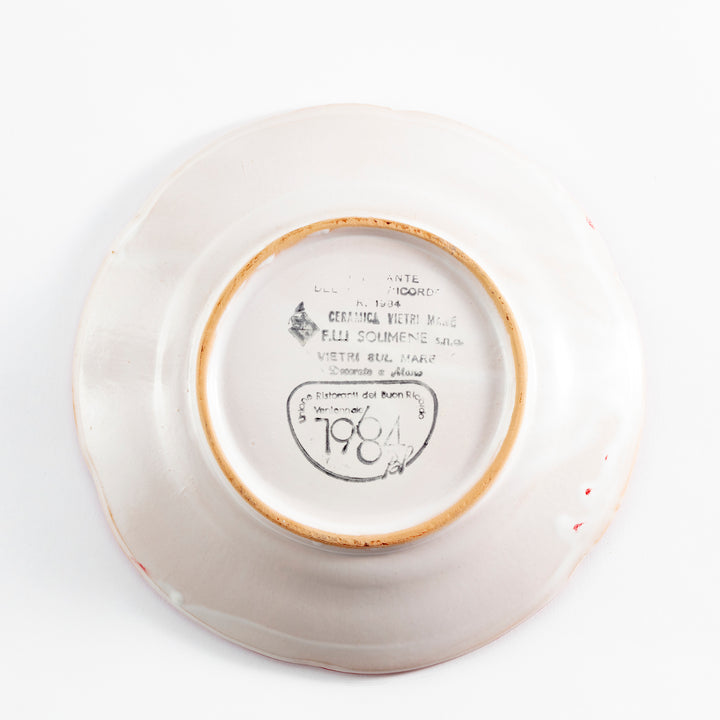 Ceramic plate with markings and stamps, possibly dated 1784.