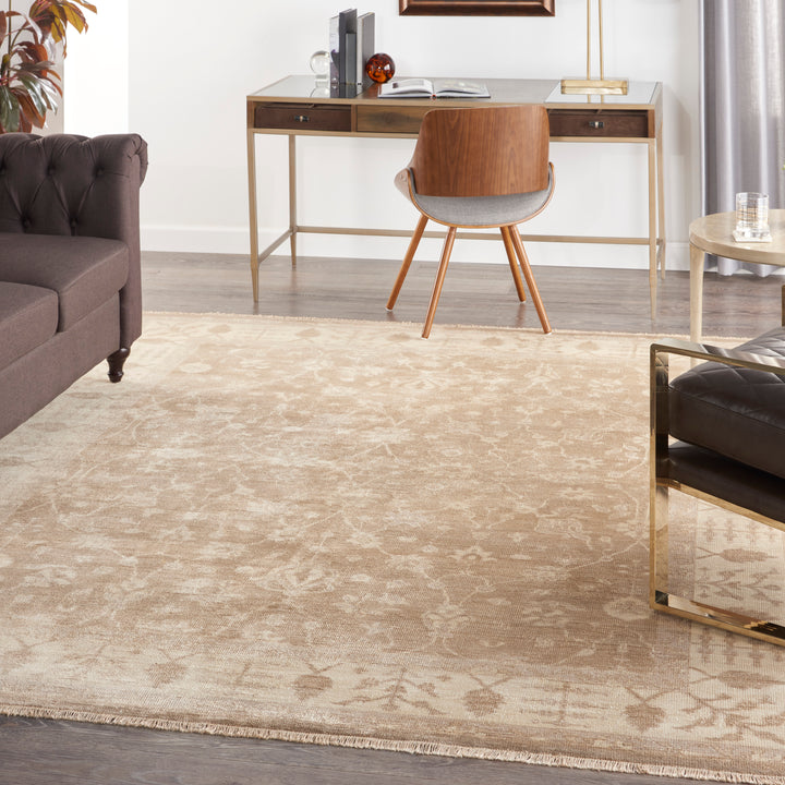 Minimalistic living or office space featuring neutral-toned furniture and décor.