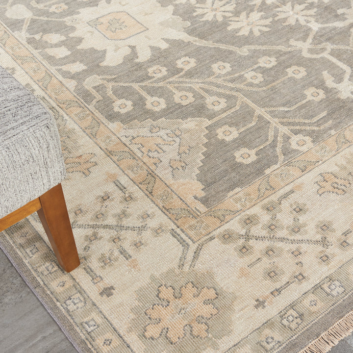 Close-up of a patterned rug with traditional aesthetic in a rustic setting.