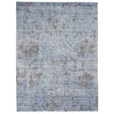 Faded blue rectangular rug with vintage distressed design and motifs.