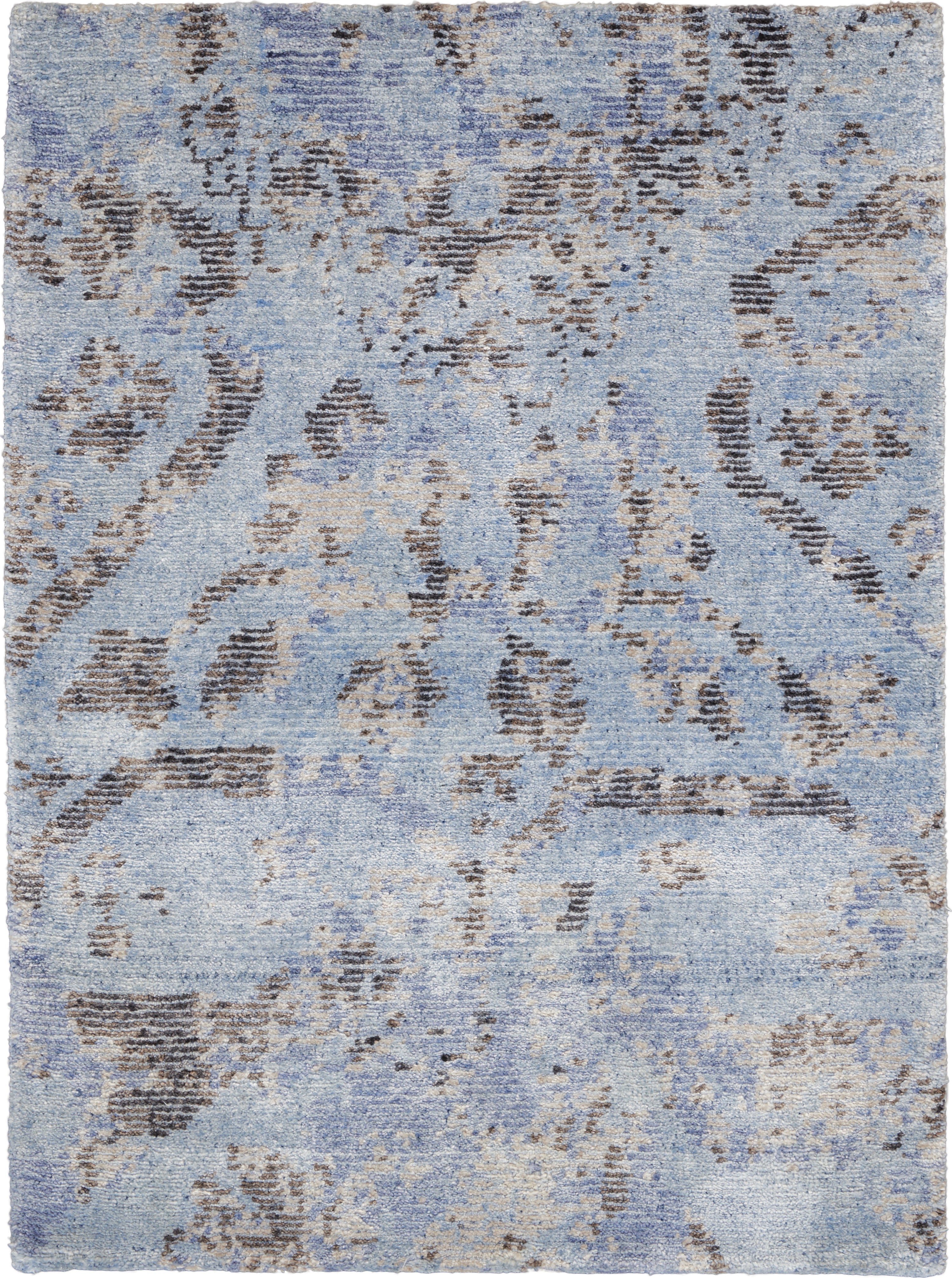 Vintage-inspired rug with a distressed blue design adds timeless charm.