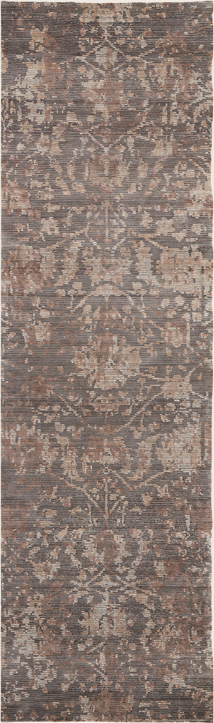 Muted, antique-style area rug with intricate floral and ornamental motifs.