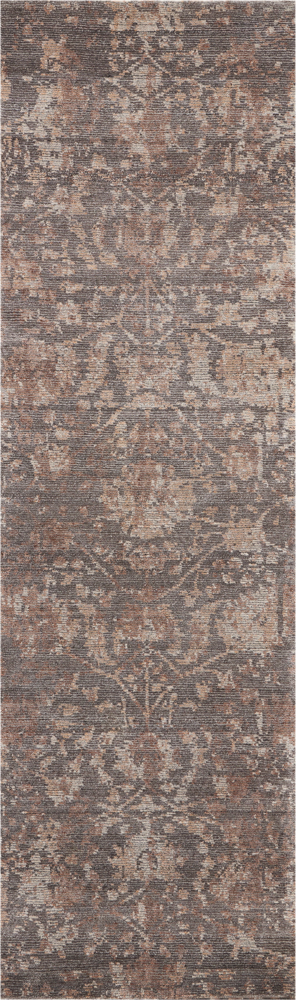 Muted, antique-style area rug with intricate floral and ornamental motifs.
