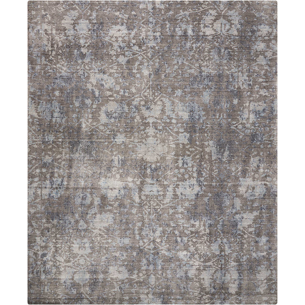 Rectangular distressed rug with muted colors and vintage-inspired design.