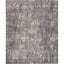 Rectangular distressed rug with muted colors and vintage-inspired design.