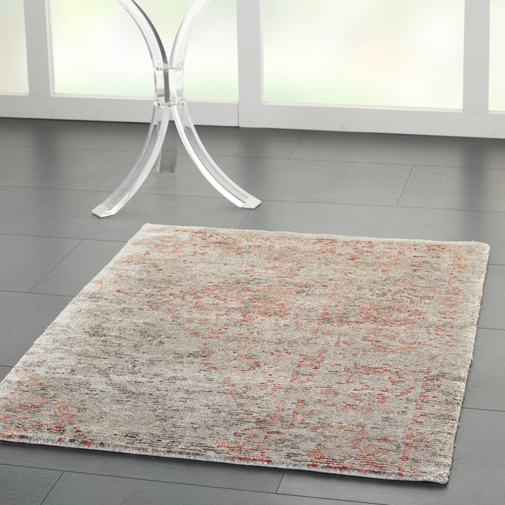 Contemporary area rug with distressed texture adds modern elegance.