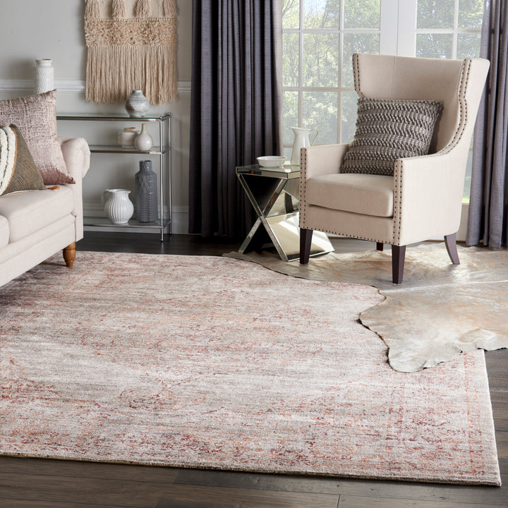 Stylishly decorated room with abstract rug, high-back chair, and decor.