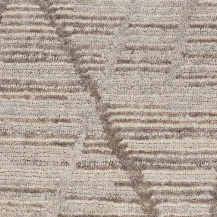 Close-up of durable, textured fabric in off-white and grayish-brown tones.