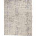 Rectangular area rug with modern distressed brush-stroke design in grayscale.
