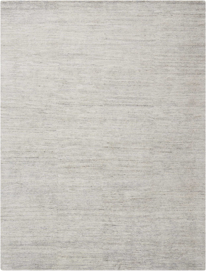Close-up of a light gray textured fabric with fine weave pattern