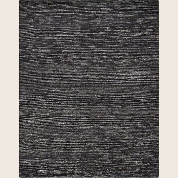 Rectangular rug with heathered gray tones and textured appearance.