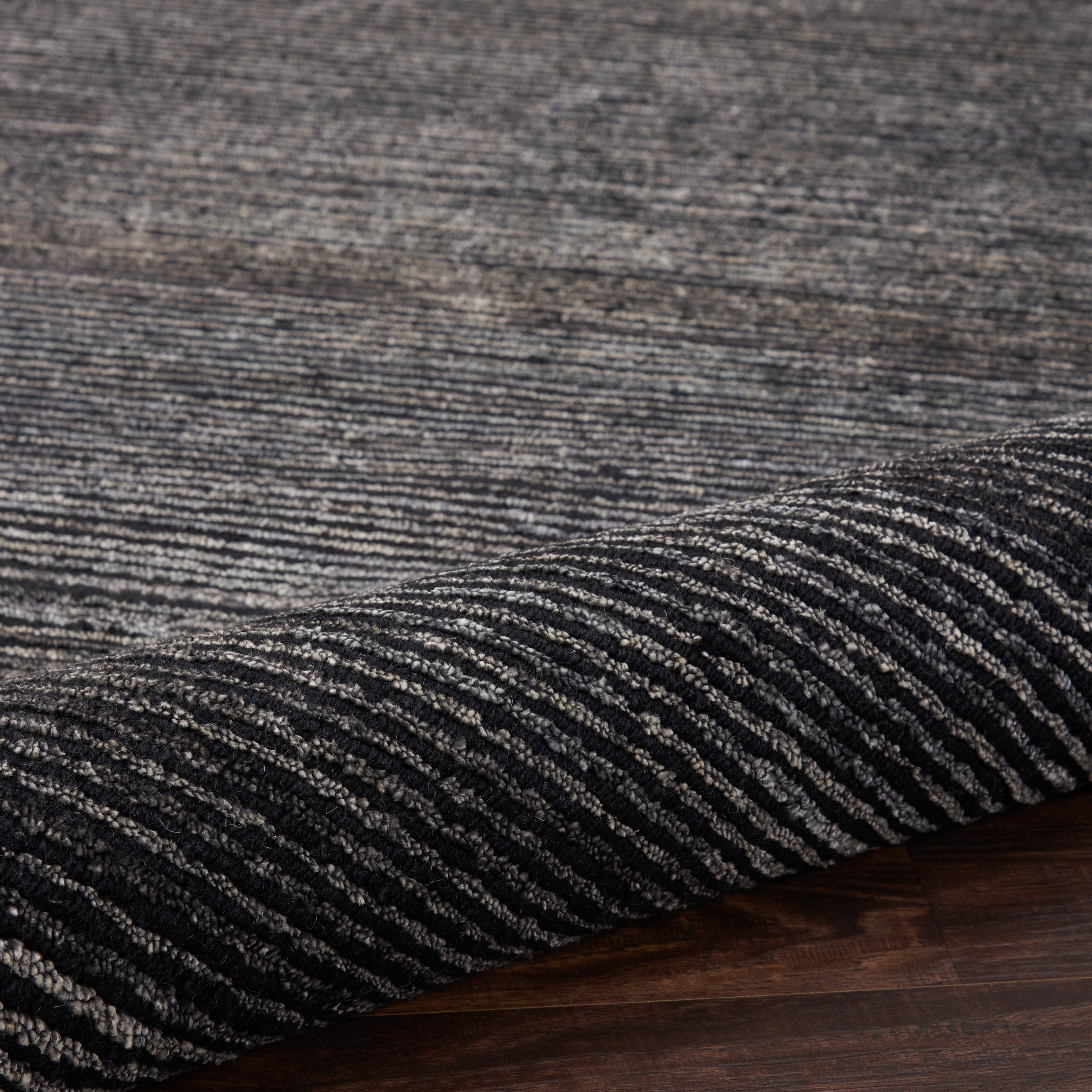 Close-up view of a textured, durable rug with striated pattern.
