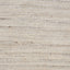 Close-up of textured, beige fabric with horizontal lines, rustic appearance.