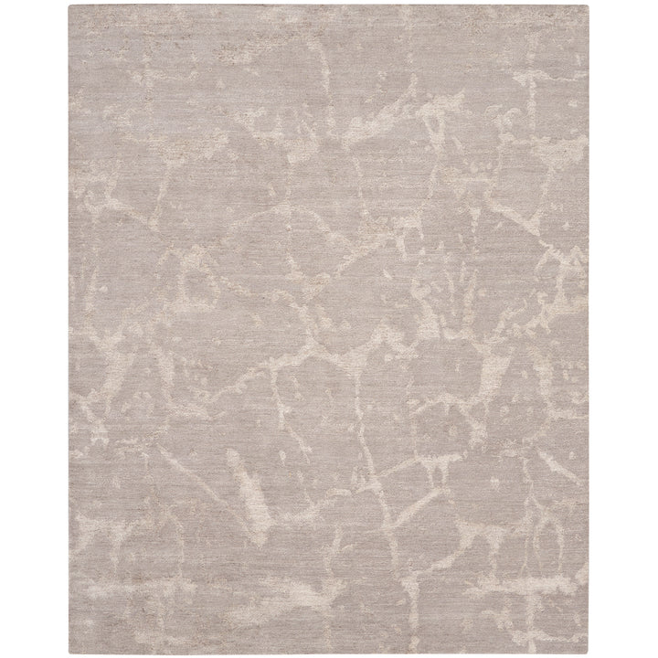 Abstract, organic-patterned rug adds subtle contemporary aesthetic to room.