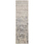 Vintage-inspired rectangular rug in muted tones with abstract distressed design.
