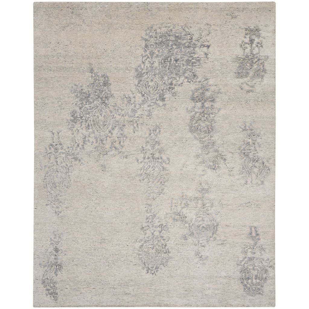 Vintage-inspired rug with subtle, distressed floral pattern; perfect for elegant interiors.