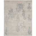Vintage-inspired rug with subtle, distressed floral pattern; perfect for elegant interiors.
