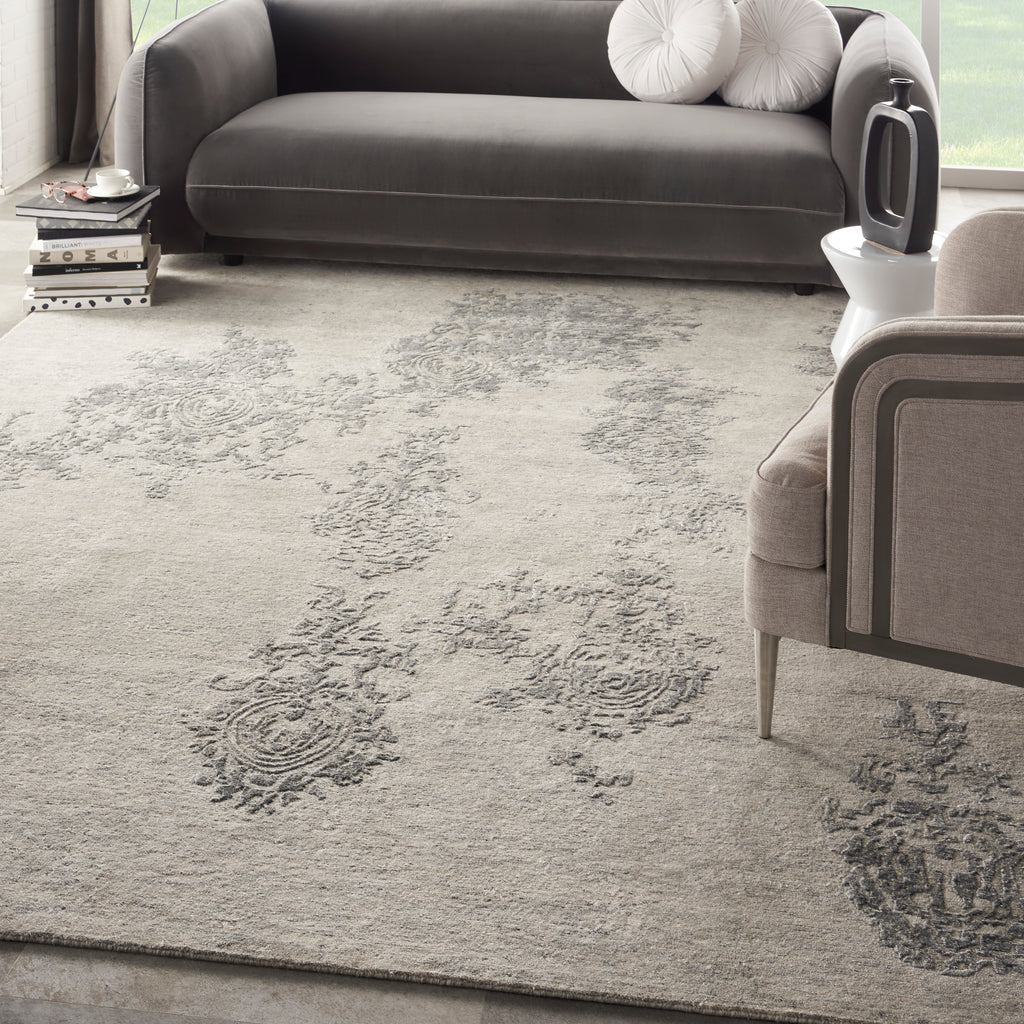 Sophisticated, modern living room with vintage-inspired rug and sleek furniture.
