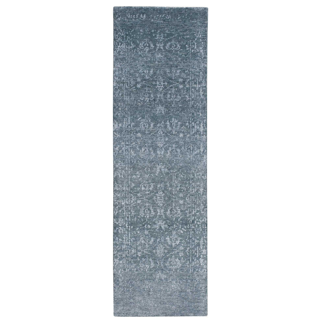 Vintage-inspired rectangular runner rug in shades of grey with distressed look.