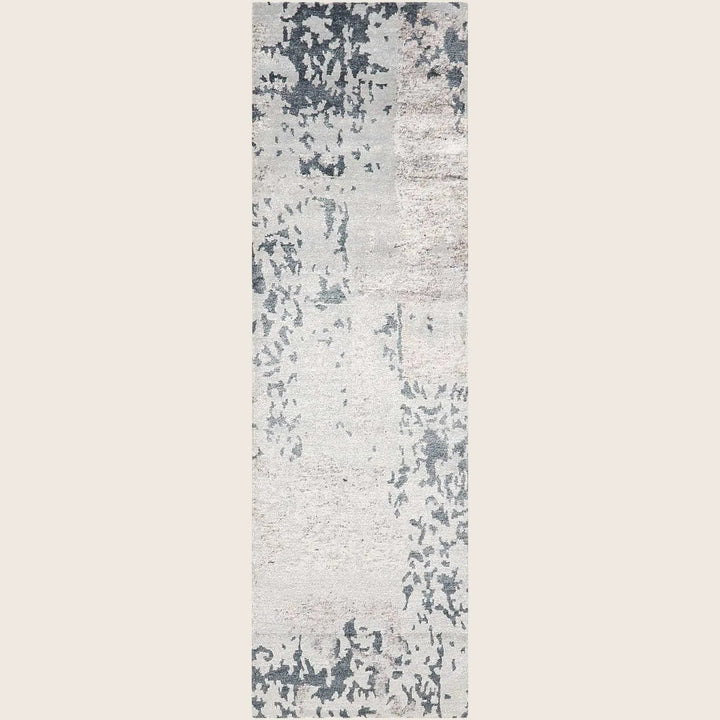 Contemporary rectangular area rug with abstract, distressed design in gray