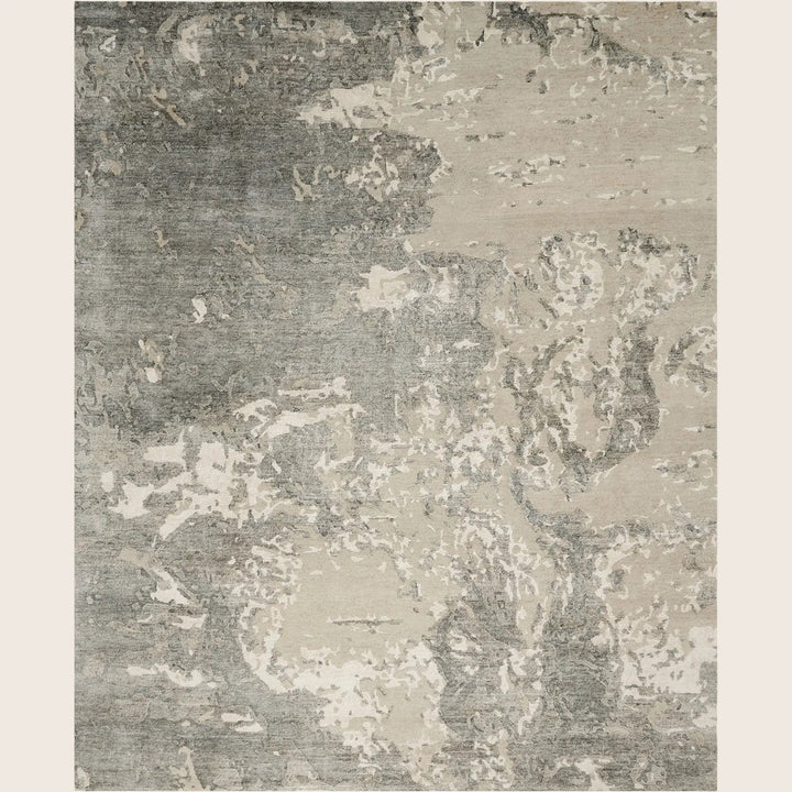 Close-up of a contemporary rug with a distressed abstract pattern.