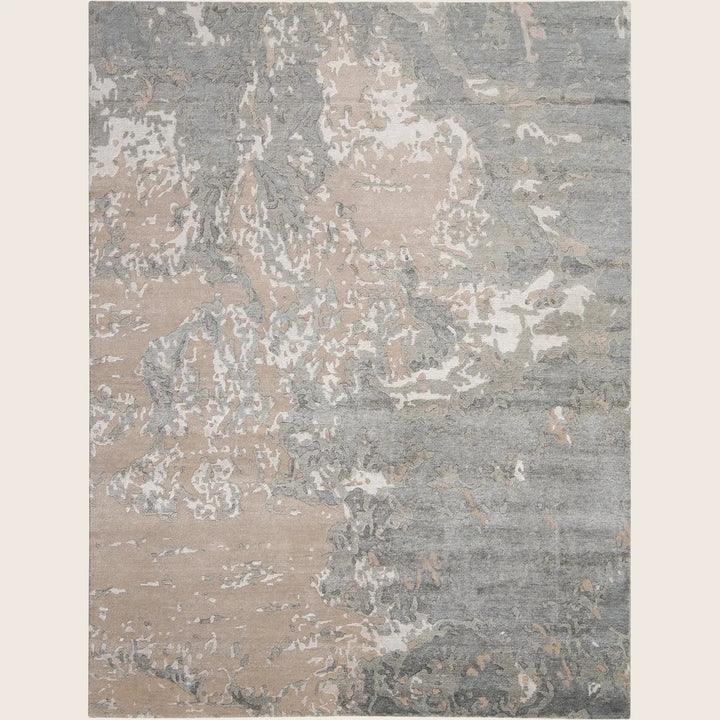 Rectangular area rug with modern abstract design in shades of grey and beige tones