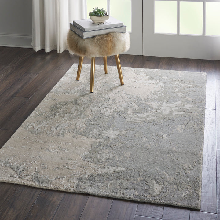 Vintage-inspired interior with a cozy rug, minimalist decor, and greenery