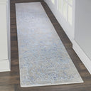 Patterned runner rug enhances the bright corridor with marbled design.