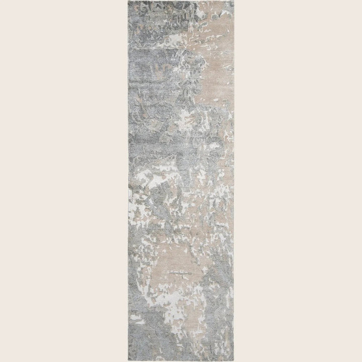Modern rectangular rug with distressed vintage design in muted colors.