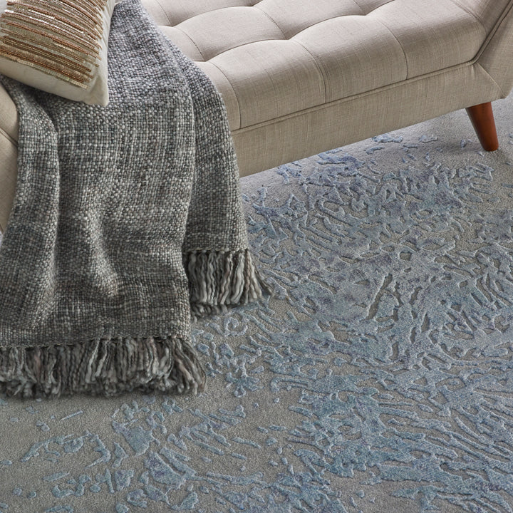 Mid-century modern style corner with cozy sofa and textured accents.