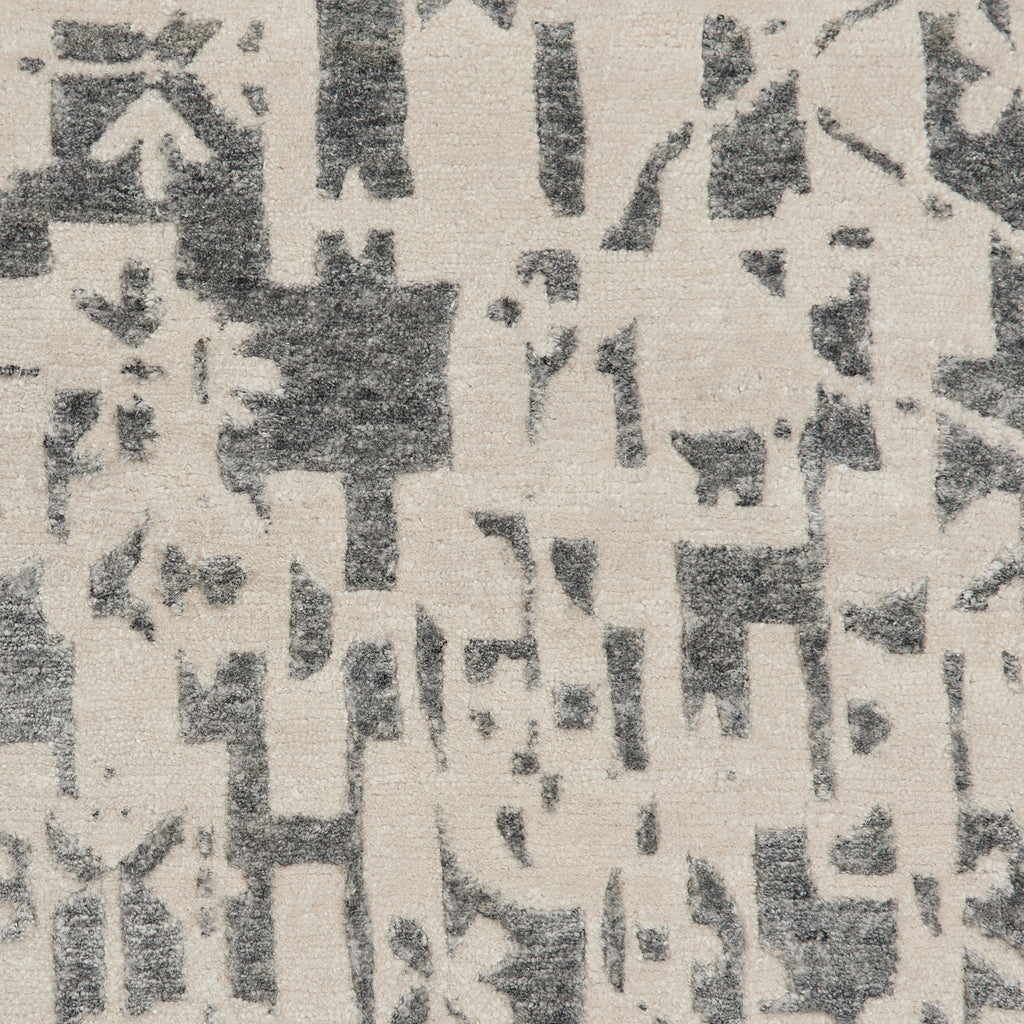 Close-up of textured fabric with abstract pattern in contrasting colors.