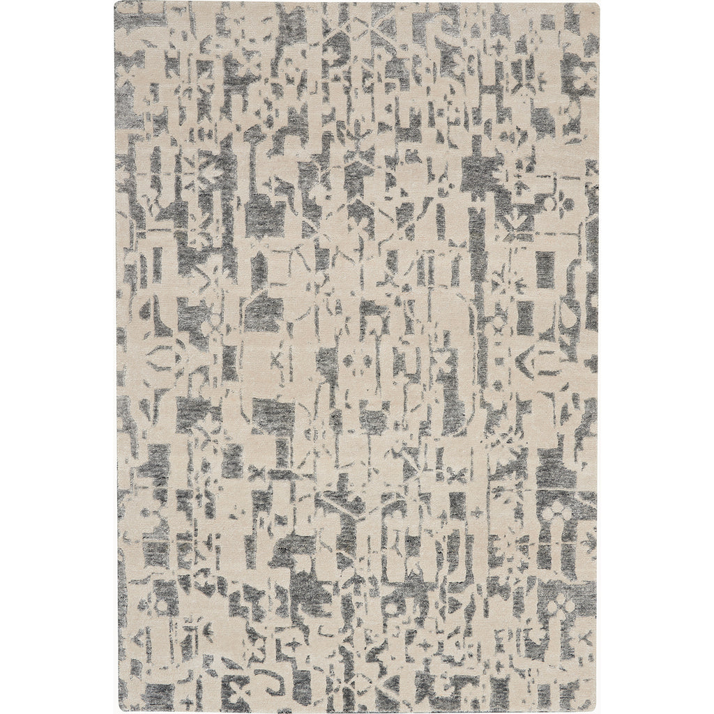 Modern abstract rug featuring grayscale shapes on an off-white background