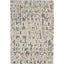 Modern abstract rug featuring grayscale shapes on an off-white background