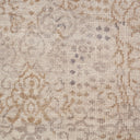 Close-up of textured fabric with floral motif in neutral tones.