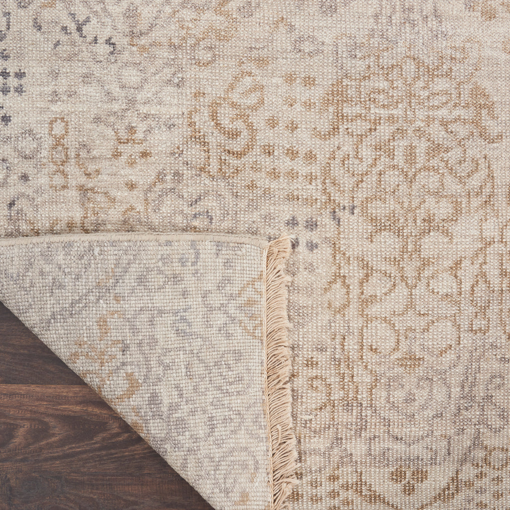 Intricately patterned rug with subtle hues and elegant aesthetic.