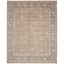 Fringed rectangular area rug with traditional, muted floral design