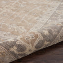 Patterned rug showcases traditional Middle Eastern design with dense texture.