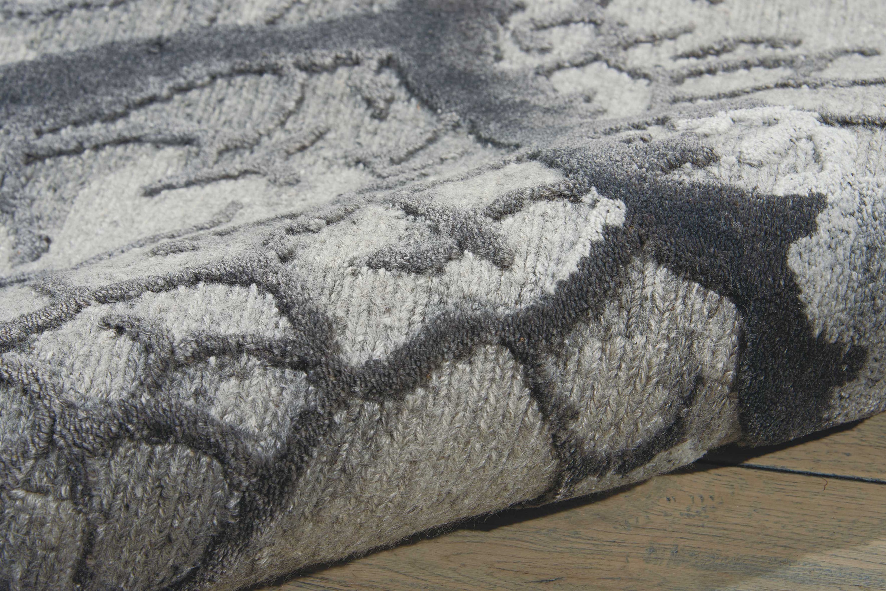 High-resolution close-up of a textured gray rug, showcasing intricate weave.