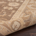 Close-up of a handcrafted tribal-inspired rug with earthy tones.