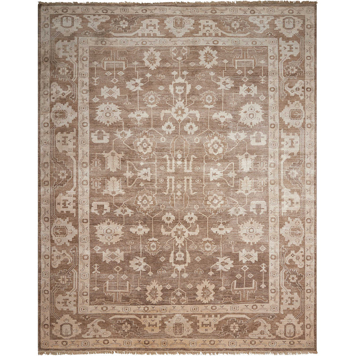 Exquisite handmade rug with complex geometric and floral motifs on muted beige and brown palette.