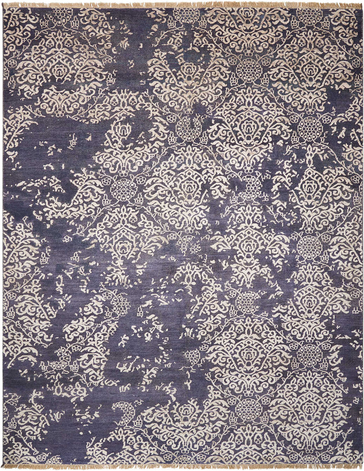Intricate floral textile with fringed border, exudes traditional craftsmanship.