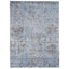 Faded blue rectangular rug with vintage distressed design and motifs.