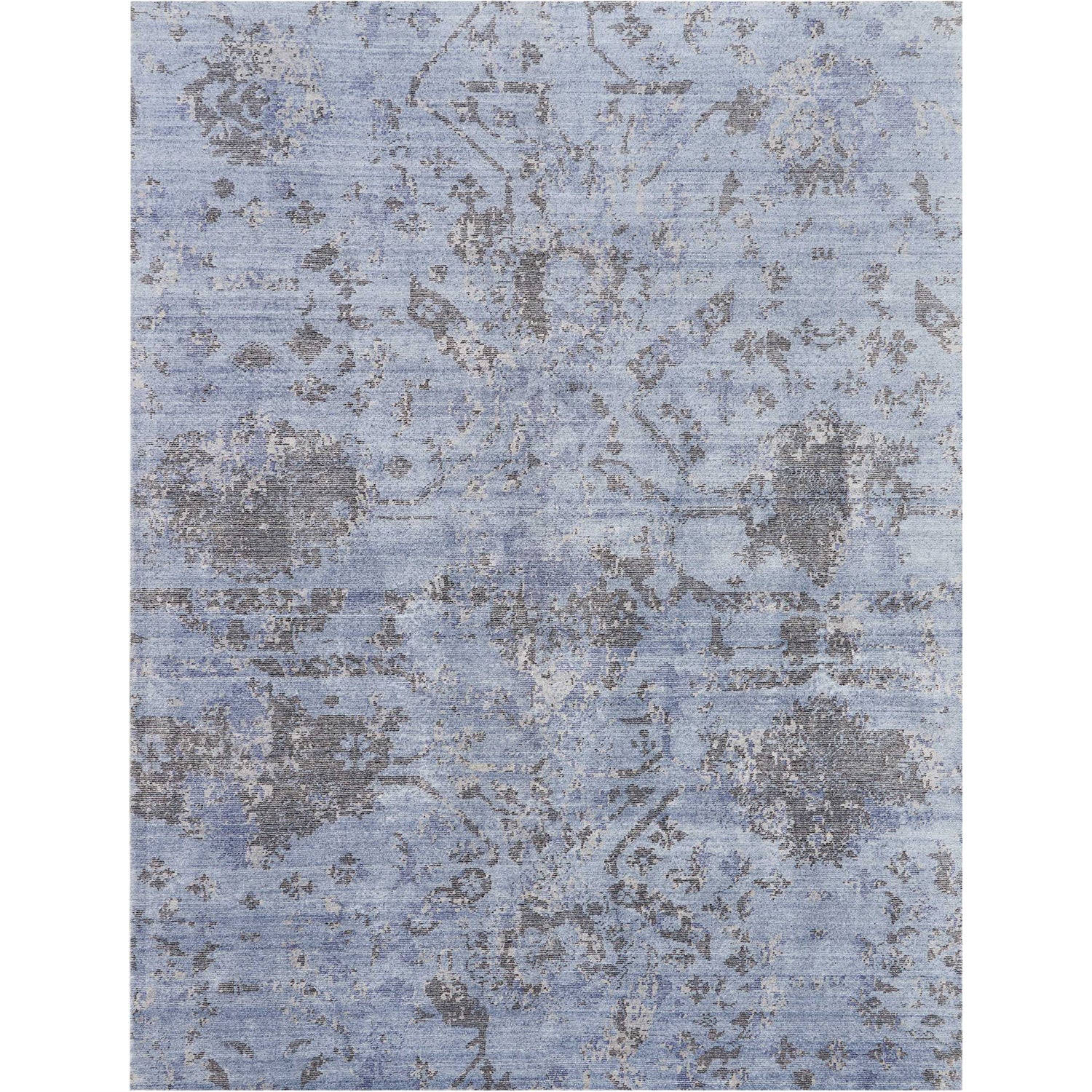 Vintage blue carpet with faded ornamental design for classic interiors.