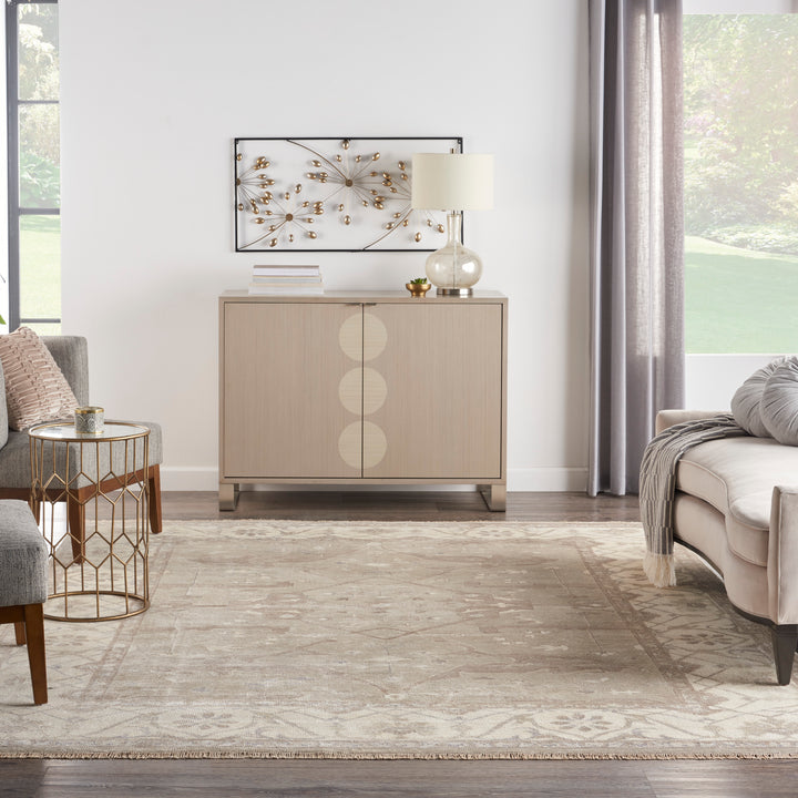 Modern and elegantly decorated living room with serene color palette.