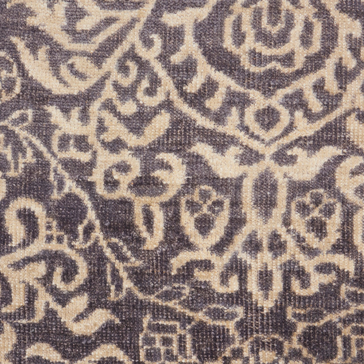 Intricate floral pattern on a dark fabric suitable for upholstery.