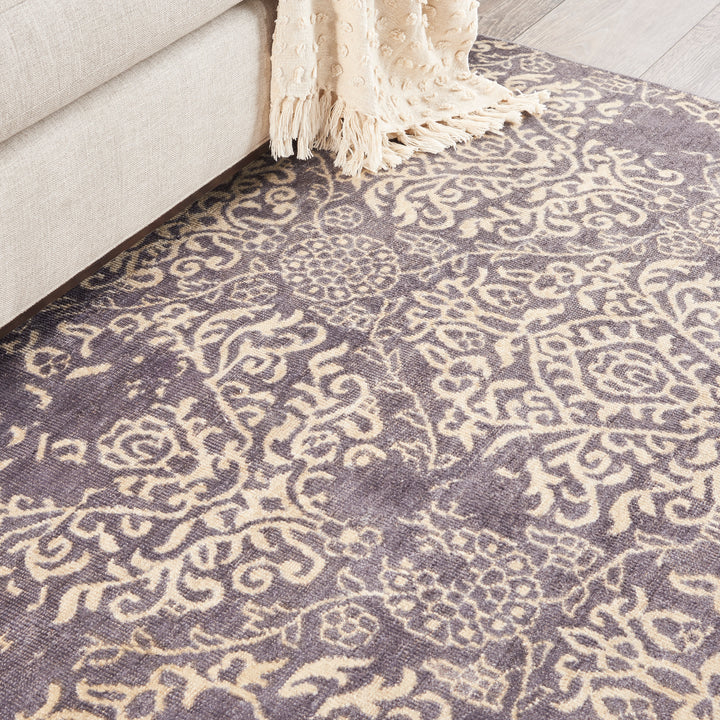 Close-up view of an intricate floral patterned area rug.