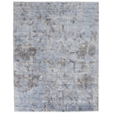 Faded blue rectangular area rug with distressed vintage pattern.