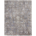 Distressed vintage rug with faded floral pattern in muted tones.